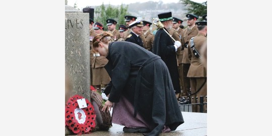 Anya laying the wreath by Kevin Moore.